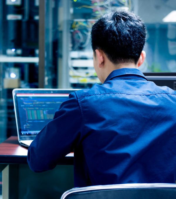 man-on-laptop-providing-network-maintenance-services